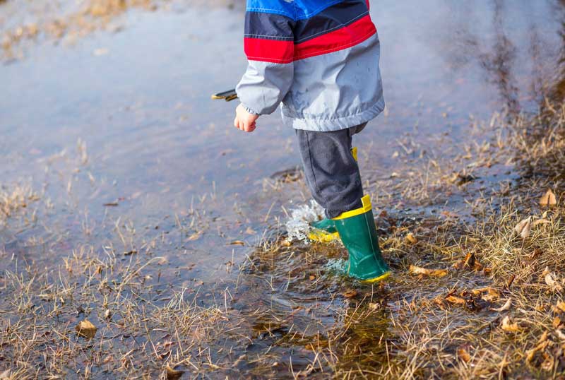 Child walking through water